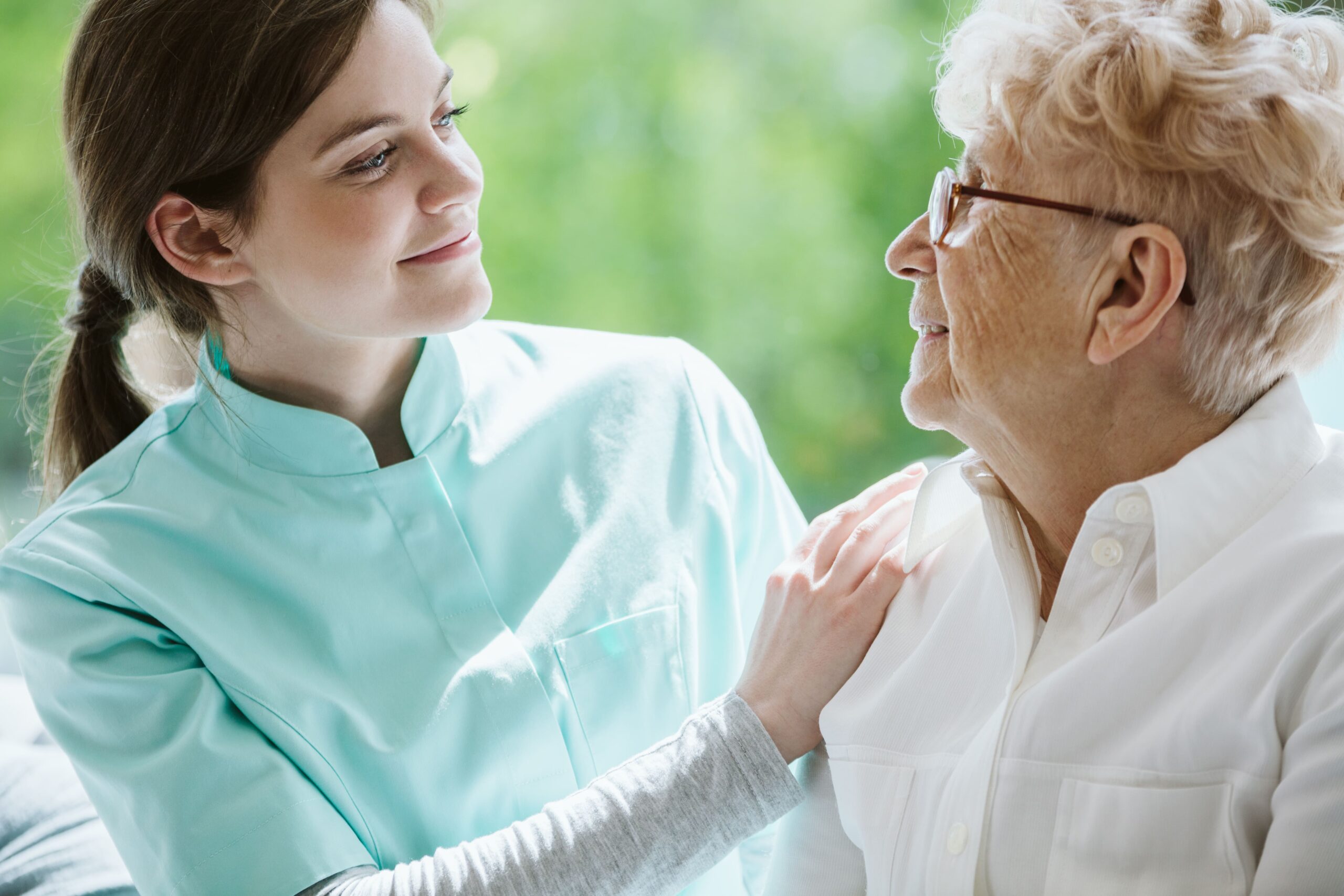 happy-senior-woman-and-helpful-caregiver-nursing