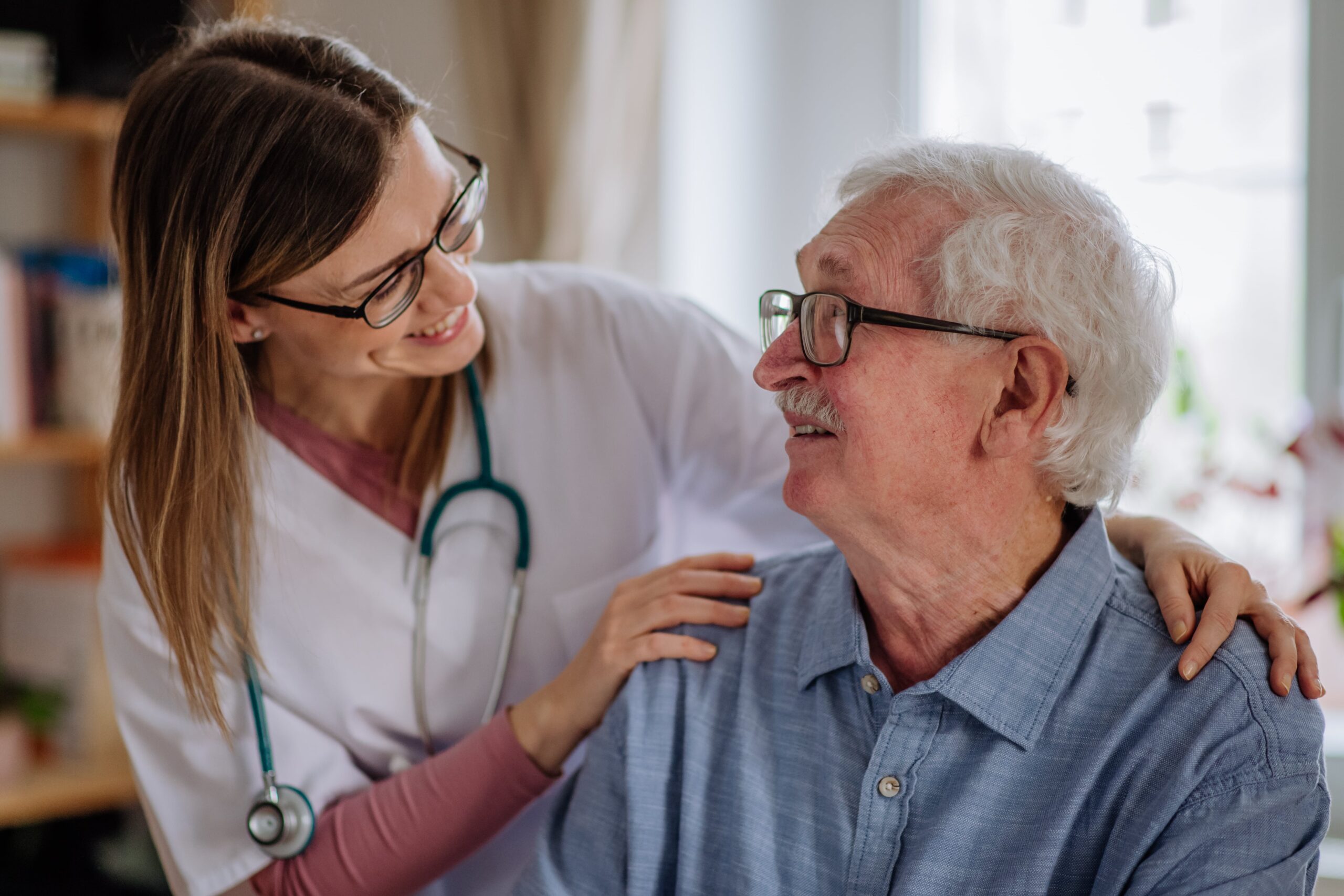 healthcare-worker-or-caregiver-visiting-senior-man